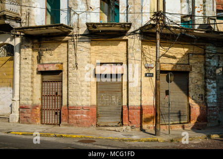 vintage storefront, closed shutters, shop exterior in old town , Stock Photo