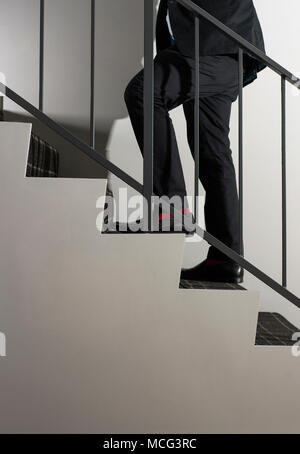 A man climbing stairs. Stock Photo