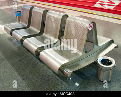 Modern metal benches installed on the platform Stock Photo