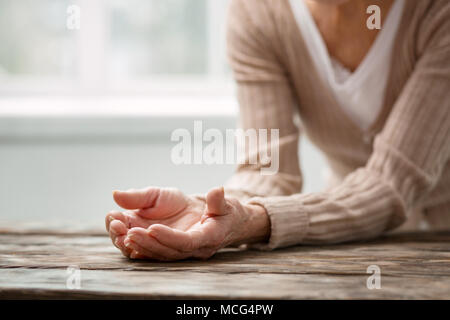 Pleasant aged woman feeling lonely Stock Photo