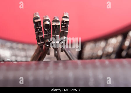 Macro detail of letters LOVE of old typewriter on red background Stock Photo