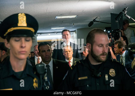 Washington DC., USA, June 8,  2017.  Former FBI Director James Comey walks out of  hearing room in the Hart Senate office building and past the gauntlet of media cameras and report4ers after appearing in front of the Senate Intelligence committee today Stock Photo
