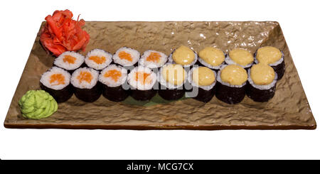 two kinds of traditional Japanese sushi rolls futomaki on a rectangular stylized plate isolated on white background Stock Photo