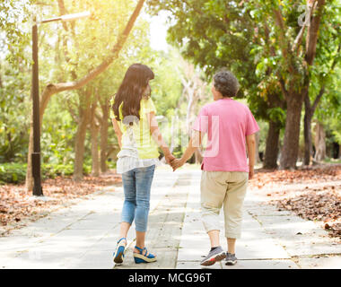 senior mother with daughter walking in the park Stock Photo