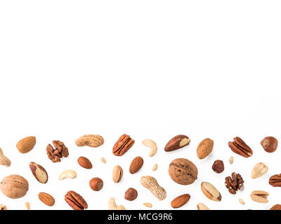 Pattern of nuts mix with copy space. Various nuts isolated on white. Pecan, macadamia, brazil nut, walnut, almonds, hazelnuts, pistachios, cashews, pe Stock Photo