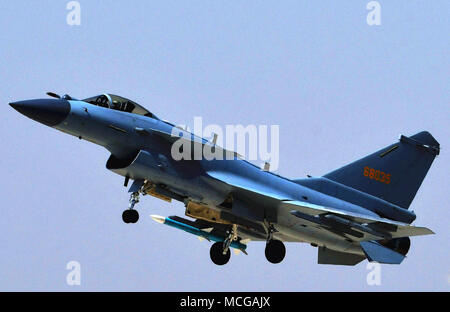 (180416) -- BEIJING, April 16, 2018 (Xinhua) -- Photo taken on April 12, 2018 shows a J-10C fighter jet in a training.  China's new multi-role fighter jet J-10C began combat duty Monday, the People's Liberation Army (PLA) air force announced.  It is China's third-generation supersonic fighter and made its debut when the PLA marked its 90th anniversary in July 2017 at Zhurihe military training base in Inner Mongolia Autonomous Region. Equipped with an advanced avionics system and various airborne weapons, the domestically-developed fighter has airstrike capabilities within medium and close rang Stock Photo