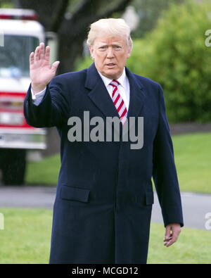Washington, District of Columbia, USA. 16th Apr, 2018. United States President DONALD J. TRUMP waves to the media as he departs the White House in Washington, DC. He is scheduled to go to Mar-a-Lago where he will meet Prime Minister Shinzo Abe of Japan later in the week. Credit: Ron Sachs/CNP/ZUMA Wire/Alamy Live News Stock Photo