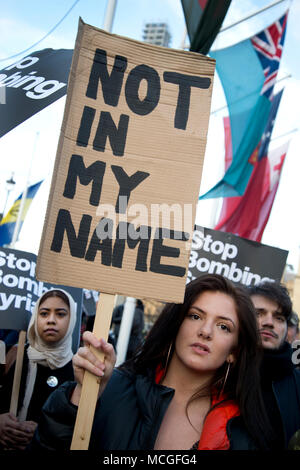 London, UK. 16th April 2018. Protest in Parliament Square, Westminster, London against the bombing of Syria called by Stop the War as Prime Minister Theresa May defended her decision to join the United States and France without recalling Parliament. A young woman holds a placard saying 'Not in my name'. Credit: Jenny Matthews/Alamy Live News Stock Photo