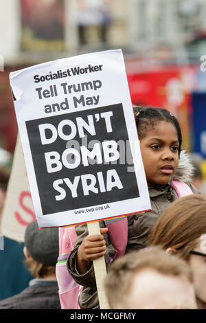 Bristol, UK. 16th April, 2018. Protesters carrying ‘Don’t bomb Syria’ placards are pictured as they march through Bristol during a Stop Bombing Syria protest march.  The rally and march was organised by the Bristol Stop the War Coalition to protest against the UK governments airstrikes in Syria. Credit: lynchpics/Alamy Live News Stock Photo