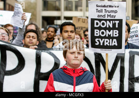 Bristol, UK. 16th April, 2018. Protesters carrying ‘Don’t bomb Syria’ placards are pictured as they march through Bristol during a Stop Bombing Syria protest march.  The rally and march was organised by the Bristol Stop the War Coalition to protest against the UK governments airstrikes in Syria. Credit: lynchpics/Alamy Live News Stock Photo