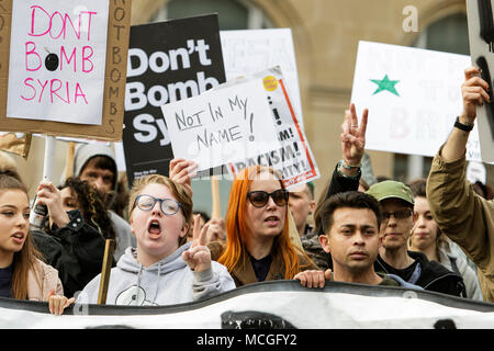 Bristol, UK. 16th April, 2018. Protesters carrying ‘Don’t bomb Syria’ placards are pictured as they march through Bristol during a Stop Bombing Syria protest march.  The rally and march was organised by the Bristol Stop the War Coalition to protest against the UK governments airstrikes in Syria. Credit: lynchpics/Alamy Live News Stock Photo