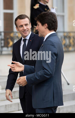Paris, France. 16th Apr, 2018. French President Emmanuel Macron (L) welcomes visiting Canadian Prime Minister Justin Trudeau at the Elysee Palace in Paris, France, on April 16, 2018. Credit: Jack Chan/Xinhua/Alamy Live News Stock Photo