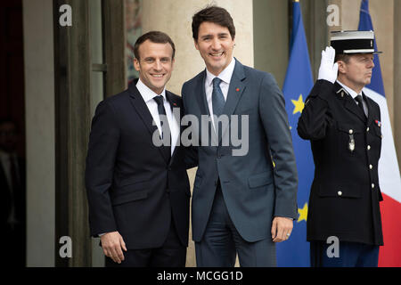 Paris, France. 16th Apr, 2018. French President Emmanuel Macron (L) welcomes visiting Canadian Prime Minister Justin Trudeau (C) at the Elysee Palace in Paris, France, on April 16, 2018. Credit: Jack Chan/Xinhua/Alamy Live News Stock Photo