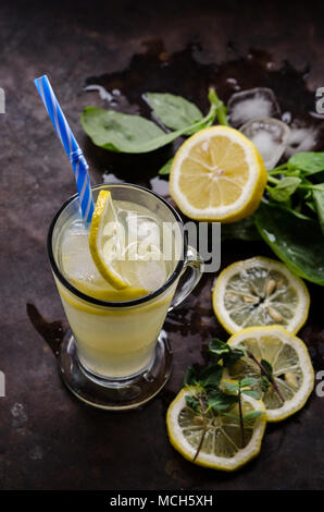 Lemonade with mint and basil on the dark background Stock Photo