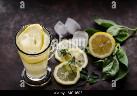 Lemonade with mint and basil on the dark background Stock Photo