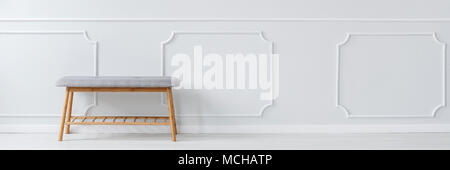 Copy space photo of bright, empty anteroom with light grey bench Stock Photo