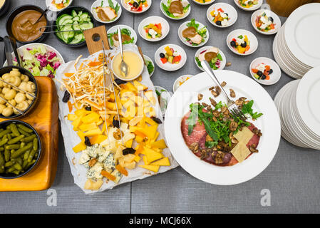 a variety of cheese varieties and meat delicacies Stock Photo