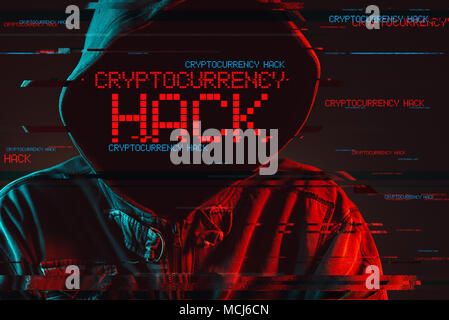Cryptocurrency hack concept with faceless hooded male person, low key red and blue lit image and digital glitch effect Stock Photo