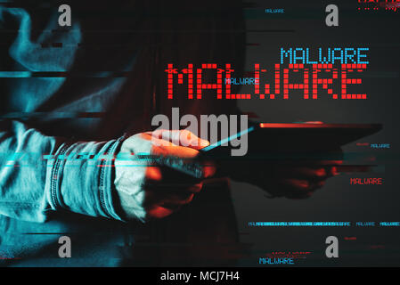 Malware concept with person using tablet computer, low key red and blue lit image and digital glitch effect Stock Photo