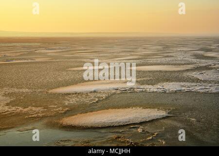 Evening atmosphere at the frozen Lake Neusiedl, near Illmitz, Seewinkel, Burgenland, Austria Stock Photo