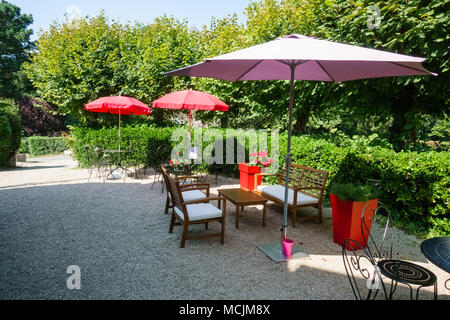 Arranged chairs and tables under the parasols in a restaurant, Brittany, France, Europe Stock Photo