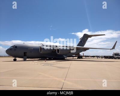 United States Airmen remove military equipment and gear from a C17 Globemaster III Aircraft during the annual African Lion 18 exercise at Agadir, Morocco, April 13, 2018. Various units from the U.S. Marine Corps, U.S. Army, U.S. Navy, and U.S. Air Force will conduct multi-lateral training with units from the Royal Moroccan Armed Forces, as well as contingents from more than a dozen Allied and partner nations. Exercise African Lion is designed to improve interoperability and mutual understanding of each nation’s tactics, techniques and procedures, with a specific focus this year on countering V Stock Photo