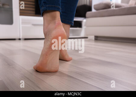 Close-up Of An Foot Walking On Heated Floor Stock Photo