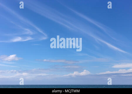 Cirrus clouds in the sky, far out to sea in Durban, South Africa. Stock Photo