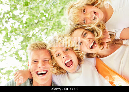 Family and children are excited and amazed at a surprise Stock Photo