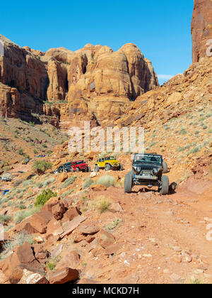 Jeeps crawl through Pritchett Canyon near Moab, Utah during Jeep Week 2018. Stock Photo