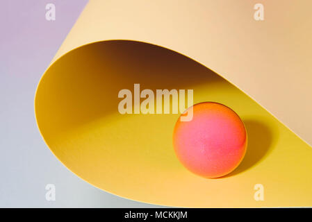 Multicolored paper background with sphere. Pastel minimal art Stock Photo