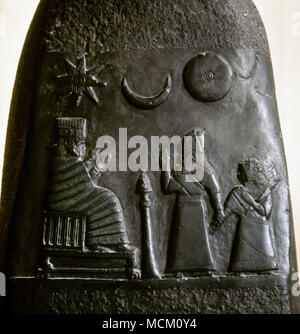 Kudurru (stele) of King Melishipak I (1186–1172 BC). The king introduces his daughter to the goddess Nannaya. The crescent moon represents the god Sin, the sun the Shamash and the star represents the goddess Ishtar. Kassite period, taken to Susa in the 12th century BC as war booty. Louvre Museum. Paris, France. Stock Photo