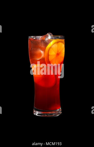 Multicolored, gradient opaque cocktail, refreshing in a tall glass with ice cubes, round slices of lemon, orange, with taste of fruits, berries. Side  Stock Photo