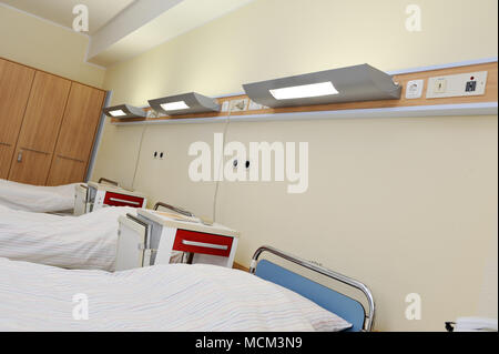 empty hospital beds in empty hospital room Stock Photo