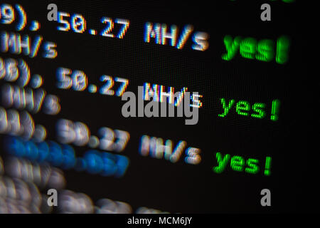 Close-up image of the computer s screen showing the blur of the programing code and a word BITCOIN for the concept of Stock Photo