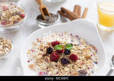 Healthy Breakfast Muesli With Milk, Chia Seeds, Berries and Cinnamon. Sunny Morning. Stock Photo