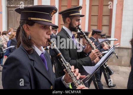 Tenerife, Canary Islands, a marching brass band of men and women plays during the Palm Sunday Holy Week procession through the streets of La Laguna. Stock Photo