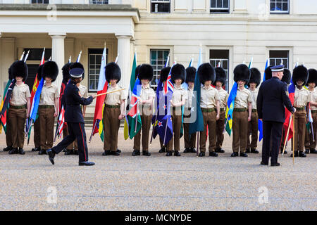 Wellington Barracks, Westminster, London, 17th April 2018. Soldiers from the Foot Guards battalion, Coldstream Guards, and the Coldstream Guards Band, are marching and rehearsing in front of Wellington Barracks, carrying the flags of the Commonwealth countries. London currently hosts the CHOGM, Commonwealth Heads of Government Meeting from 16-20th April 2018. Credit: Imageplotter News and Sports/Alamy Live News Stock Photo