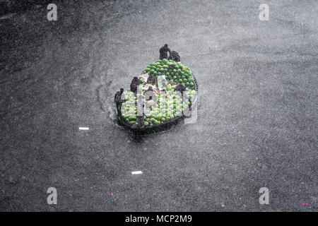 Dhaka, Bangladesh. 17th Apr, 2018. Watermelons transporting boat attack of sudden rain in the river burigonga at sadarghat, Dhaka, Bangladesh on April 17, 2018. Credit: Jahangir Alam Onuchcha/Alamy Live News Stock Photo