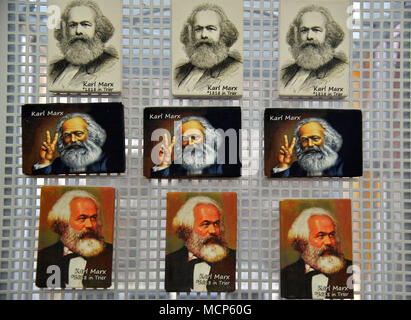10 April 2018, Trier, Germany: Karl Marx magnets attached to a metal tray at the Trier tourist information. Several products have been created on the occasion of the 200th birthday of the philosopher Karl Marx. Photo: Harald Tittel/dpa