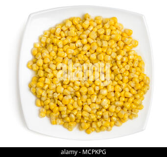 Portion of cooked corn on plate top view. Isolated on white Stock Photo