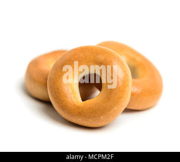 Small pile of bagels isolated on white Stock Photo