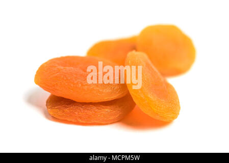 Arranged dried apricots isolated on white Stock Photo
