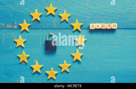 European Union sign with a padlock on a blue rustic wooden background, DSGVO concept image Stock Photo