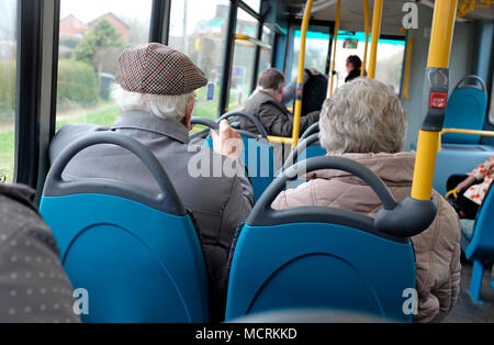 elderly couple on public transport rural bus service, norfolk, england Stock Photo