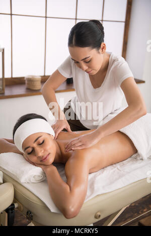 Nice young woman doing a massage Stock Photo