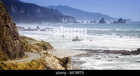 The winding ocean side road along the West Coast Region of the South Island, New Zealand. Stock Photo