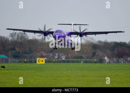 Flybe ATR 72 EI-FMJ operated by Stobart taking off from London Southend Airport. ATR72 turboprop airliner plane. Purple scheme Stock Photo