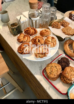 Freshly Baked Cinnamon Roll Pastries at Cafe Shop. Bakery Concept. Stock Photo