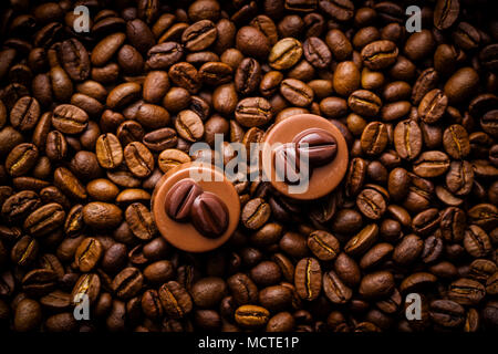 Belgian pralines with coffee flavor and coffee beans. Stock Photo